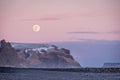 Sunset and moon rise over mountains and VikÃ¢â¬â¢s black sand beach in Iceland